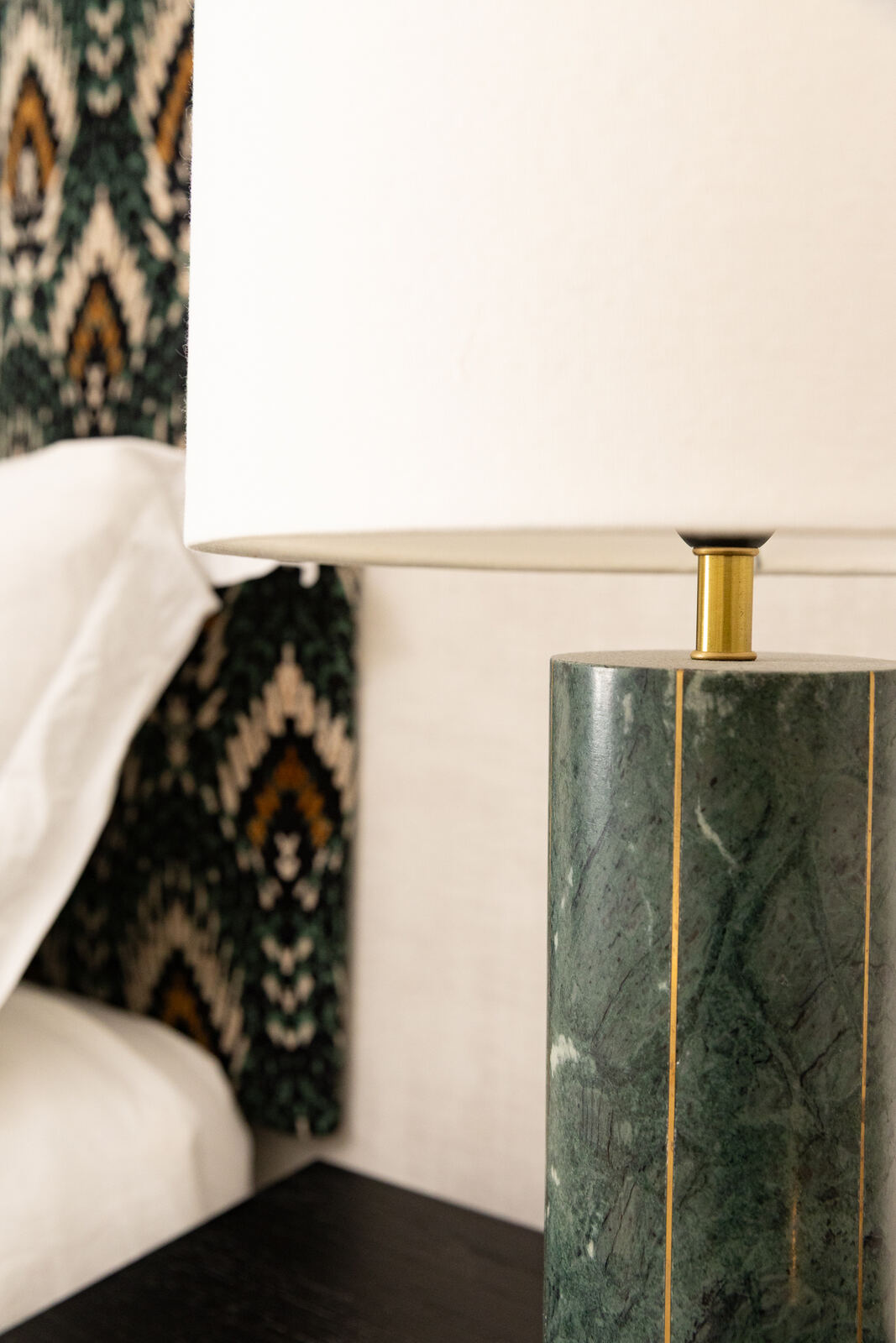 Oak bedside with soft lamp light